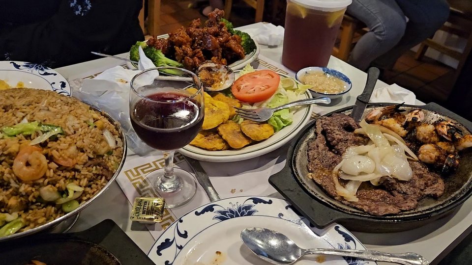 A seafood and rice meal on white plates